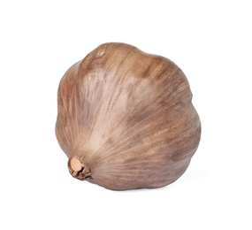 Unpeeled bulb of black garlic on white background