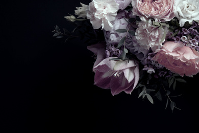 Beautiful bouquet of different flowers on black background, space for text. Floral card design with dark vintage effect