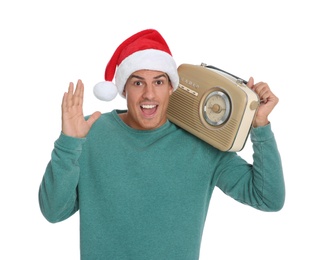 Photo of Emotional man with vintage radio on white background. Christmas music