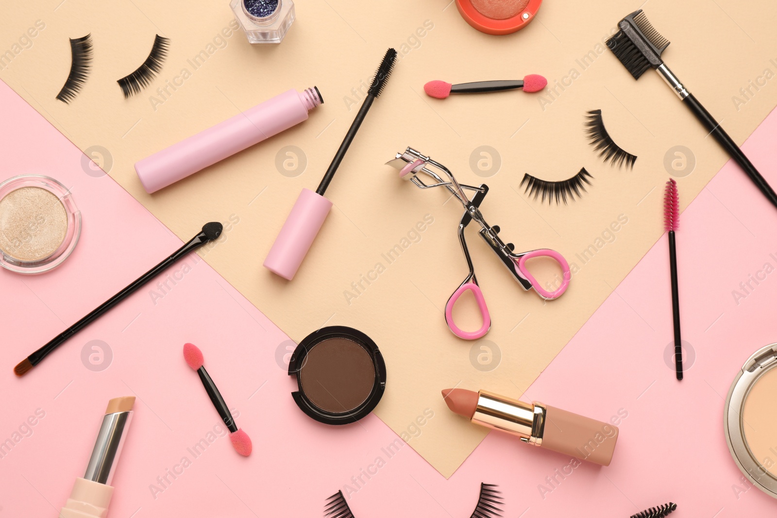 Photo of Flat lay composition with eyelash curler, makeup products and accessories on color background