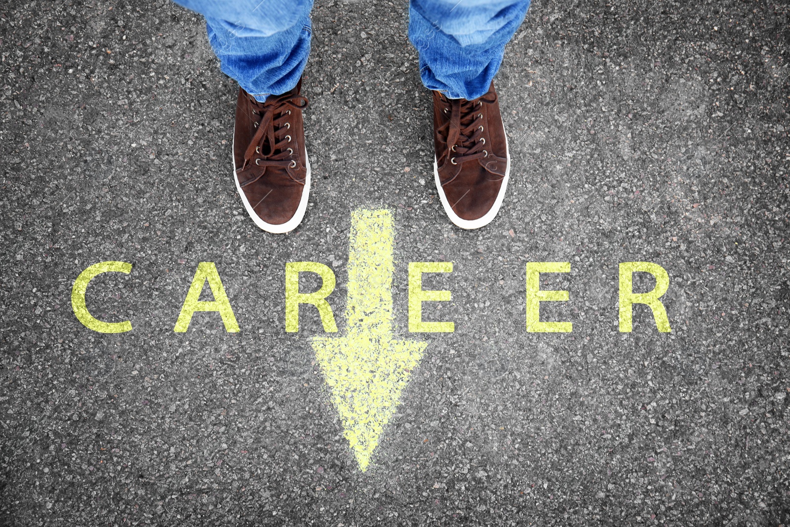 Image of Man standing near arrow on asphalt, above view. Career choice concept