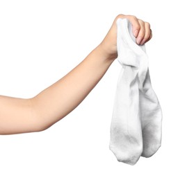 Photo of Woman holding dirty socks on white background, closeup