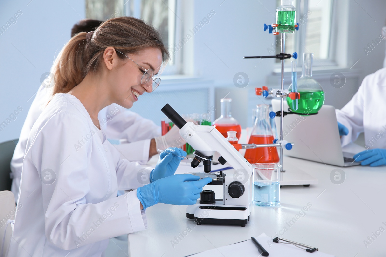 Photo of Medical students working in modern scientific laboratory