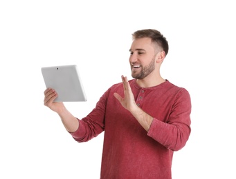Photo of Young man using video chat on tablet against white background