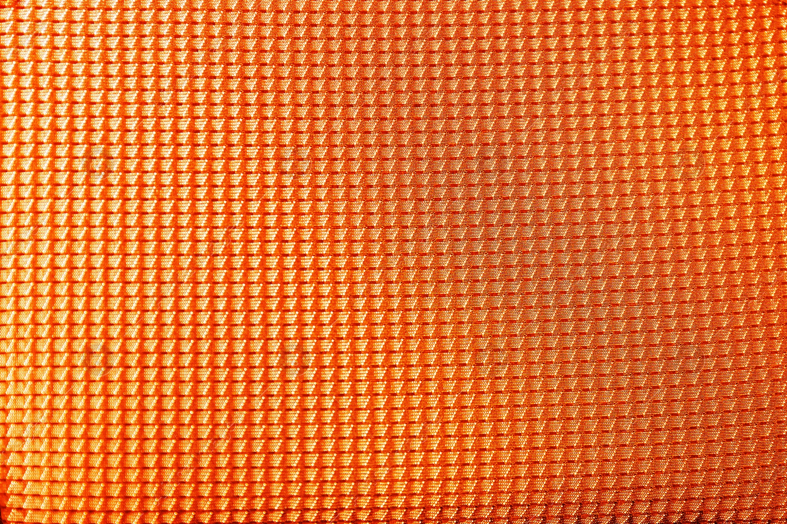 Image of Textured orange fabric as background, closeup view