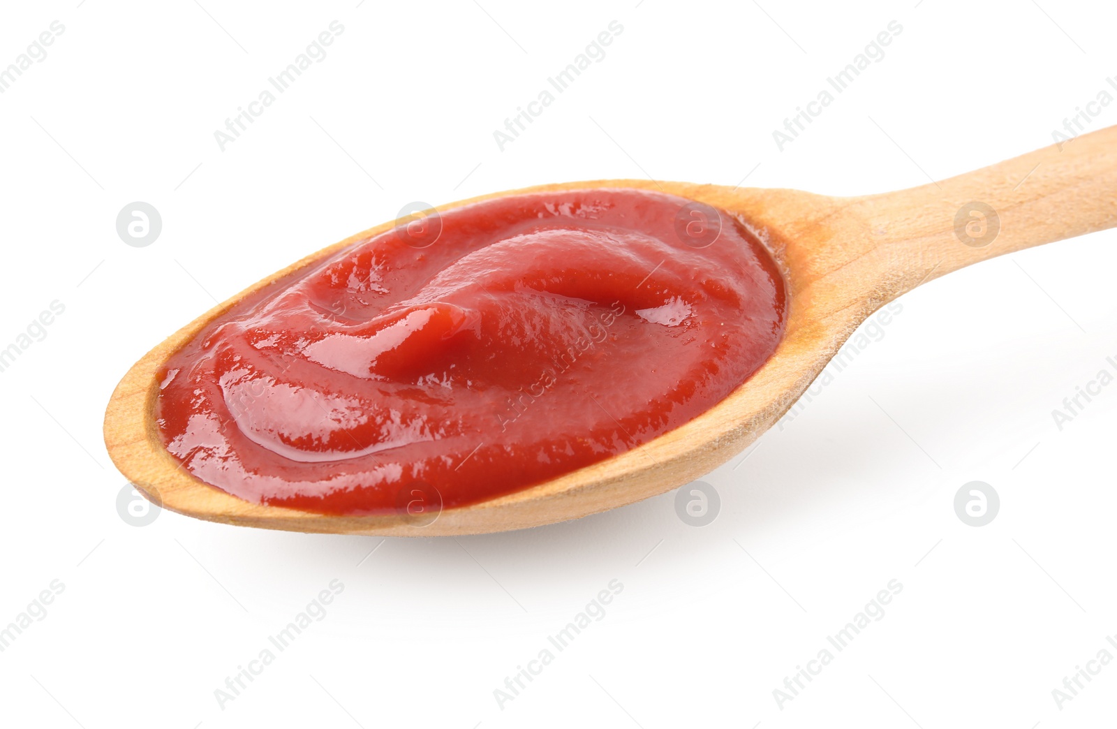 Photo of Wooden spoon with tasty ketchup isolated on white