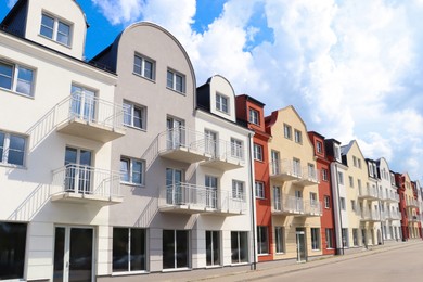 Modern houses with balconies on city street