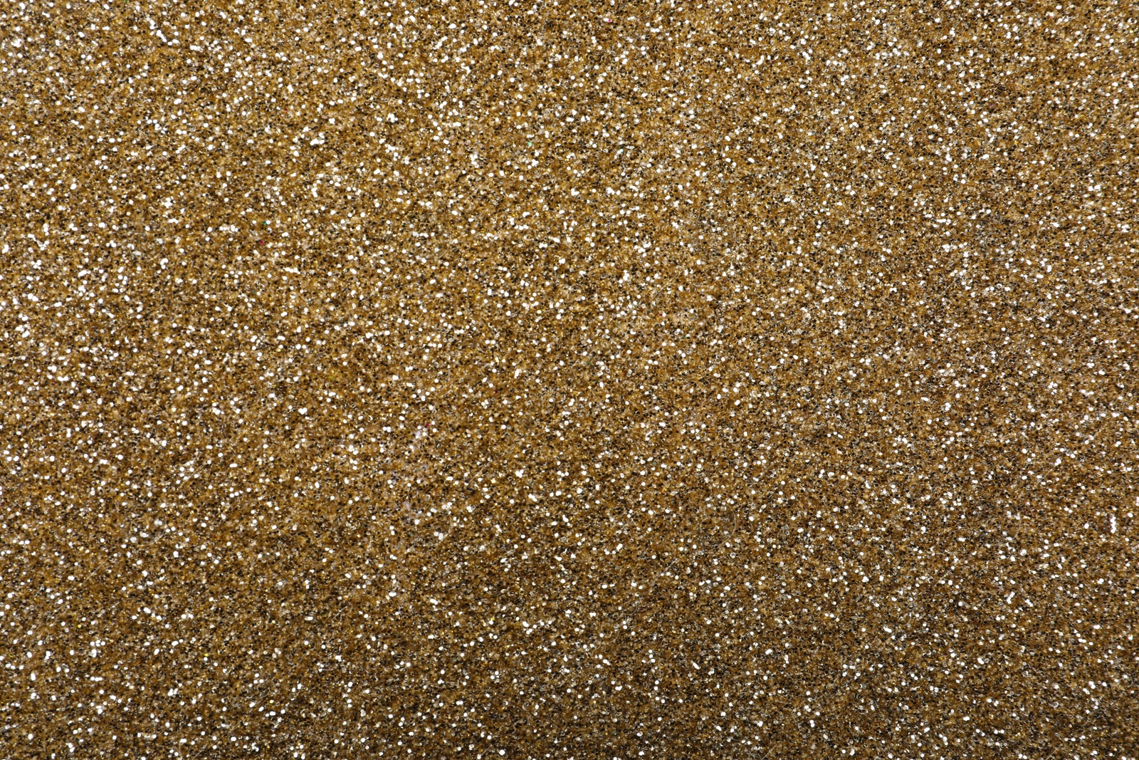 Photo of Beautiful shiny brass glitter as background, closeup