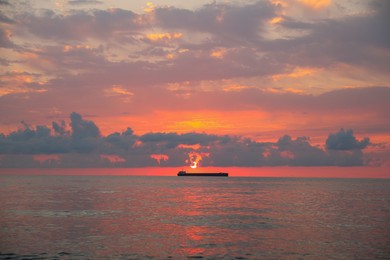 Picturesque view of sunset with clouds over sea