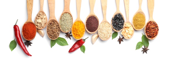 Photo of Composition with different aromatic spices in wooden spoons on white background