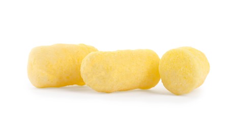 Tasty puffy corn puffs on white background