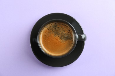 Cup of tasty coffee on white background, top view