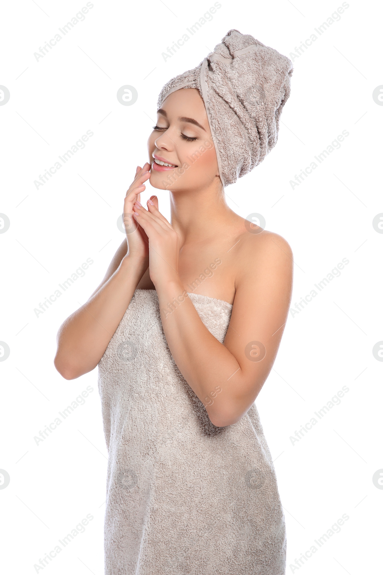 Photo of Portrait of young pretty woman with towels on white background