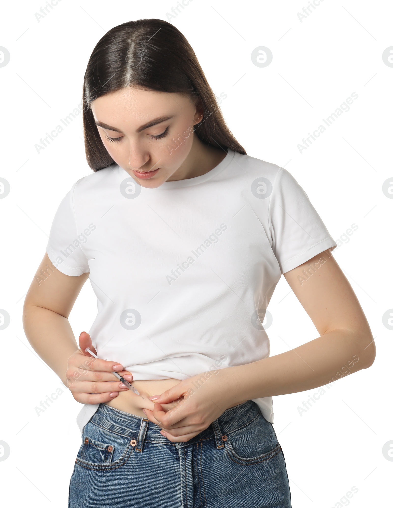 Photo of Diabetes. Woman making insulin injection into her belly on white background