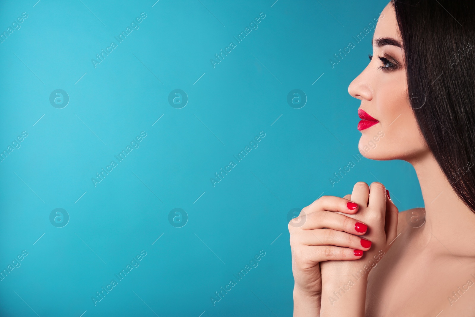 Photo of Beautiful woman with stylish nail polish on color background, space for text