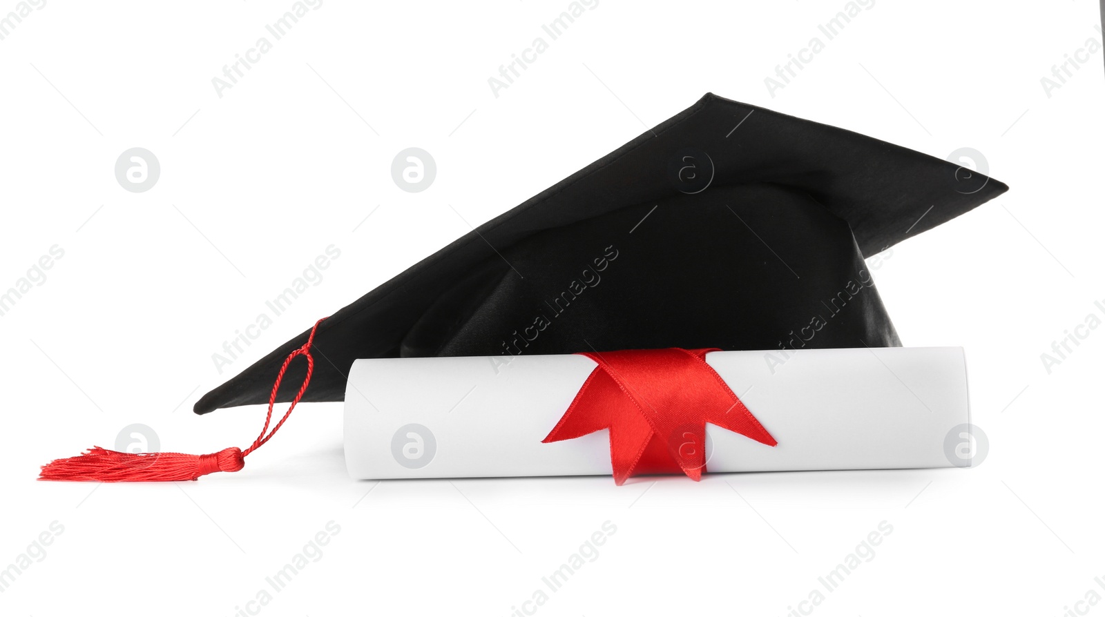 Photo of Graduation hat and diploma on white background