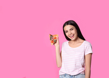 Beautiful woman with pizza on pink background, space for text