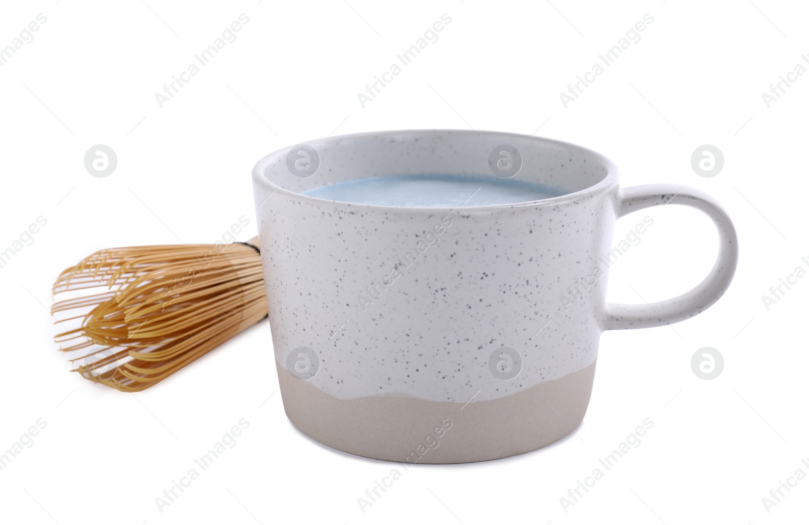 Image of Blue matcha latte in cup and chasen on white background 