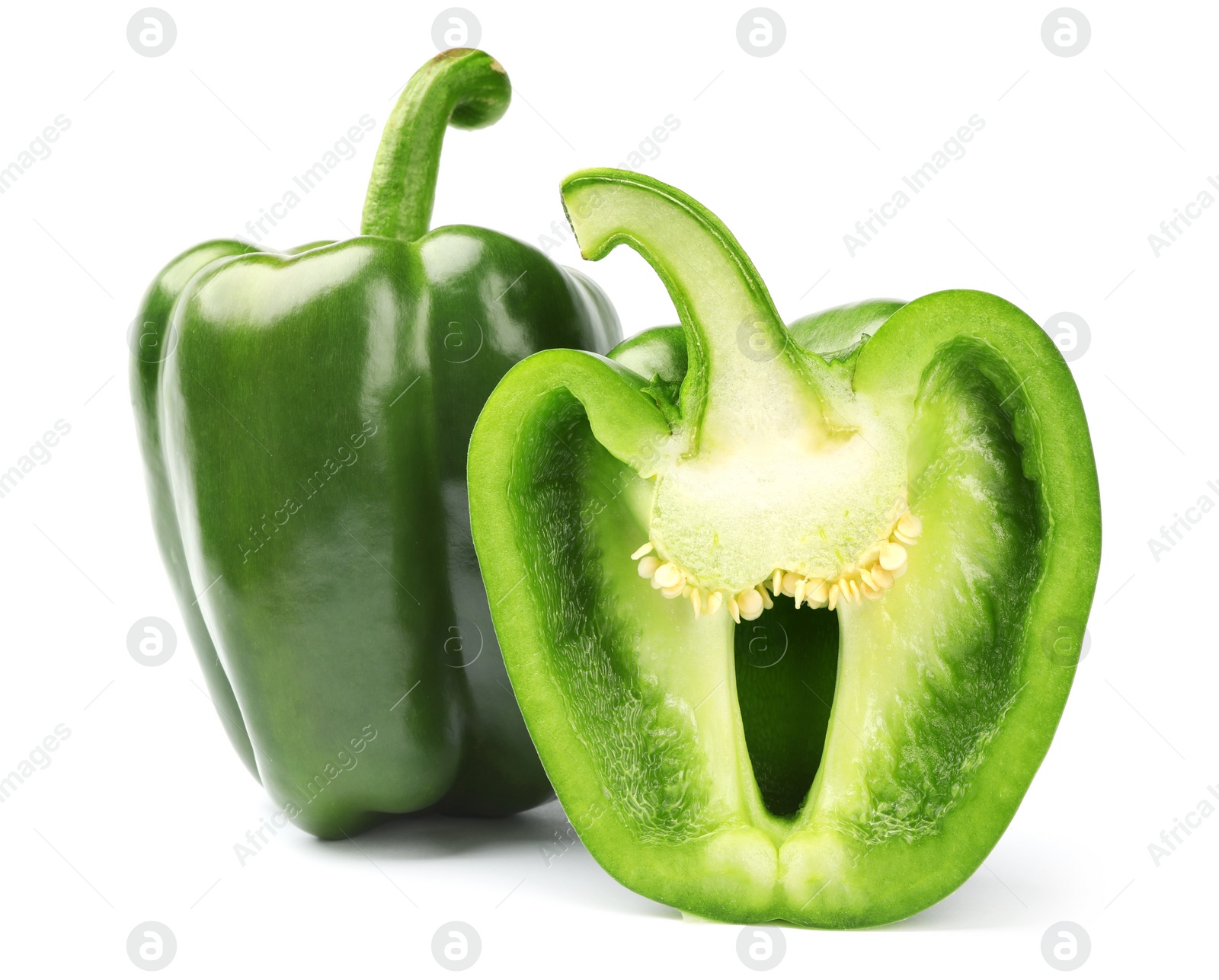 Photo of Cut and whole tasty green bell peppers on white background