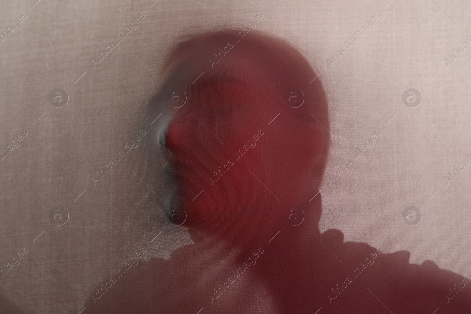 Photo of Silhouette of creepy ghost behind cloth, color toned