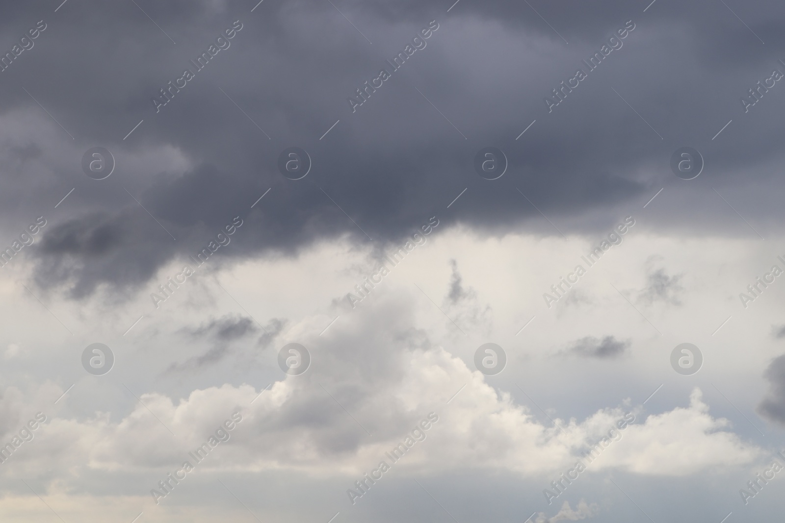 Photo of Sky with heavy rainy clouds on grey day