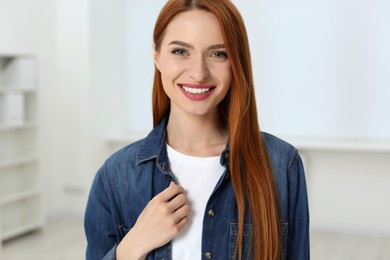 Portrait of beautiful young woman at home