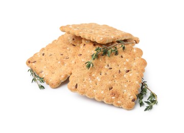 Photo of Cereal crackers with flax, sesame seeds and thyme isolated on white