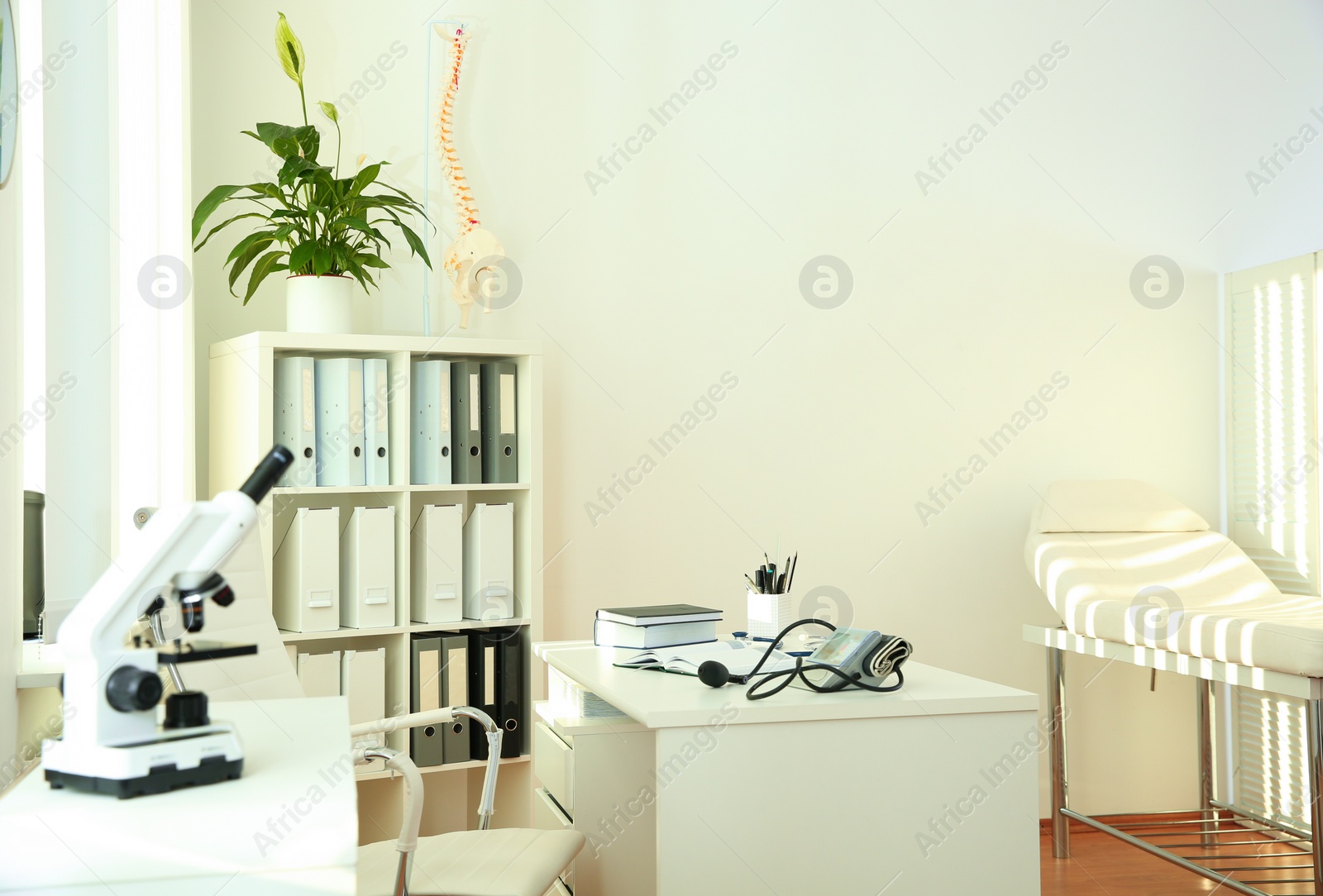 Photo of Interior of modern medical office. Doctor's workplace