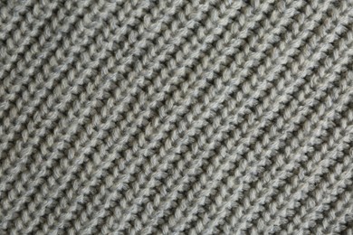 Photo of Beautiful grey knitted fabric as background, top view