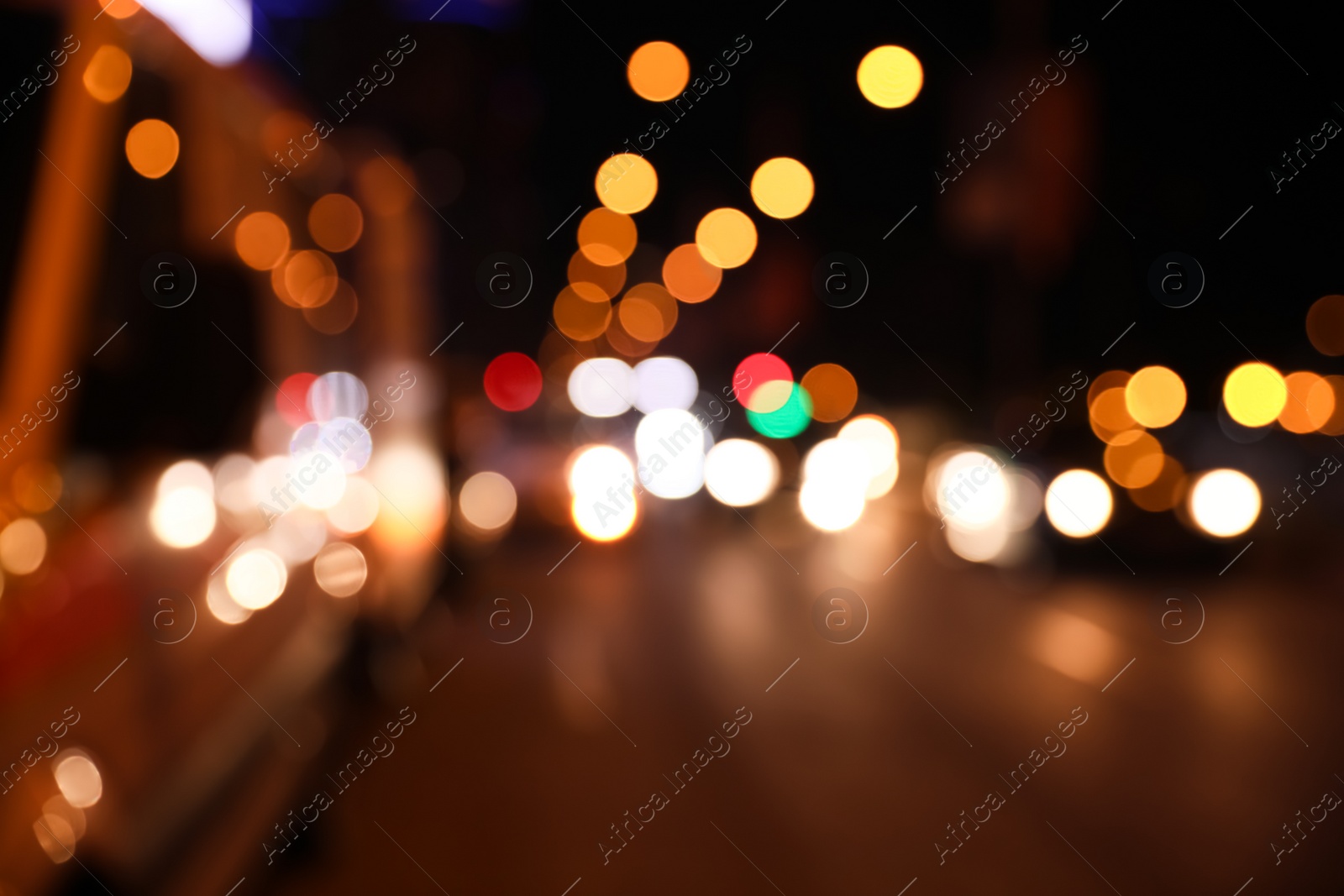 Photo of Blurred view of cityscape with bokeh effect. Night life