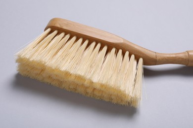 Photo of Cleaning brush on grey background, closeup view