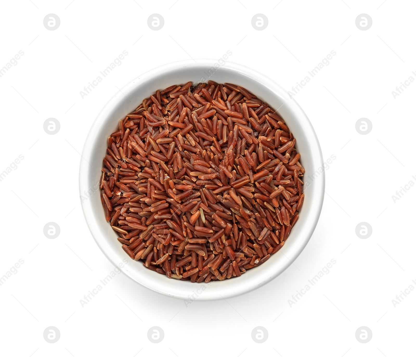 Photo of Bowl with uncooked red rice on white background, top view