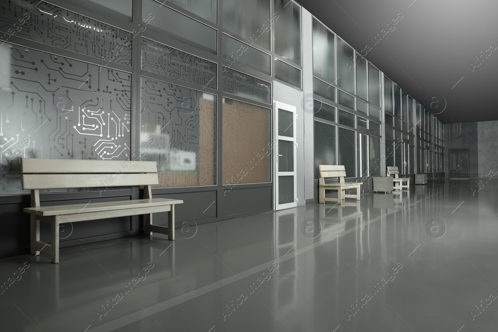 Photo of Modern empty office corridor with glass wall and benches