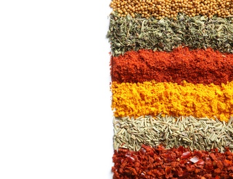 Rows of different aromatic spices on white background, top view with space for text