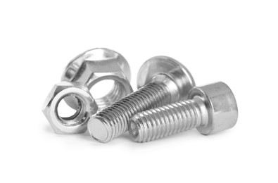 Photo of Different metal bolts and nuts on white background