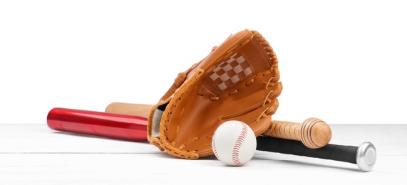 Baseball glove, bats and ball on wooden table against white background