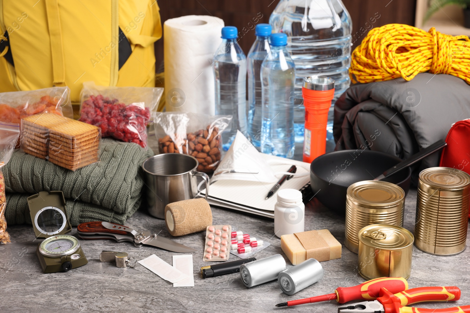 Photo of Disaster supply kit for earthquake on grey table