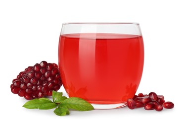 Photo of Refreshing pomegranate juice in glass, leaves and seeds isolated on white