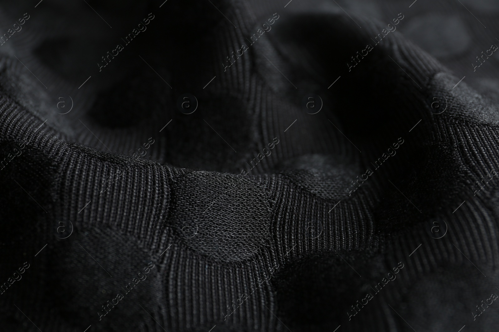 Photo of Textured black fabric as background, closeup view