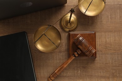 Photo of Law concept. Gavel, book and scales of justice on wooden table, flat lay