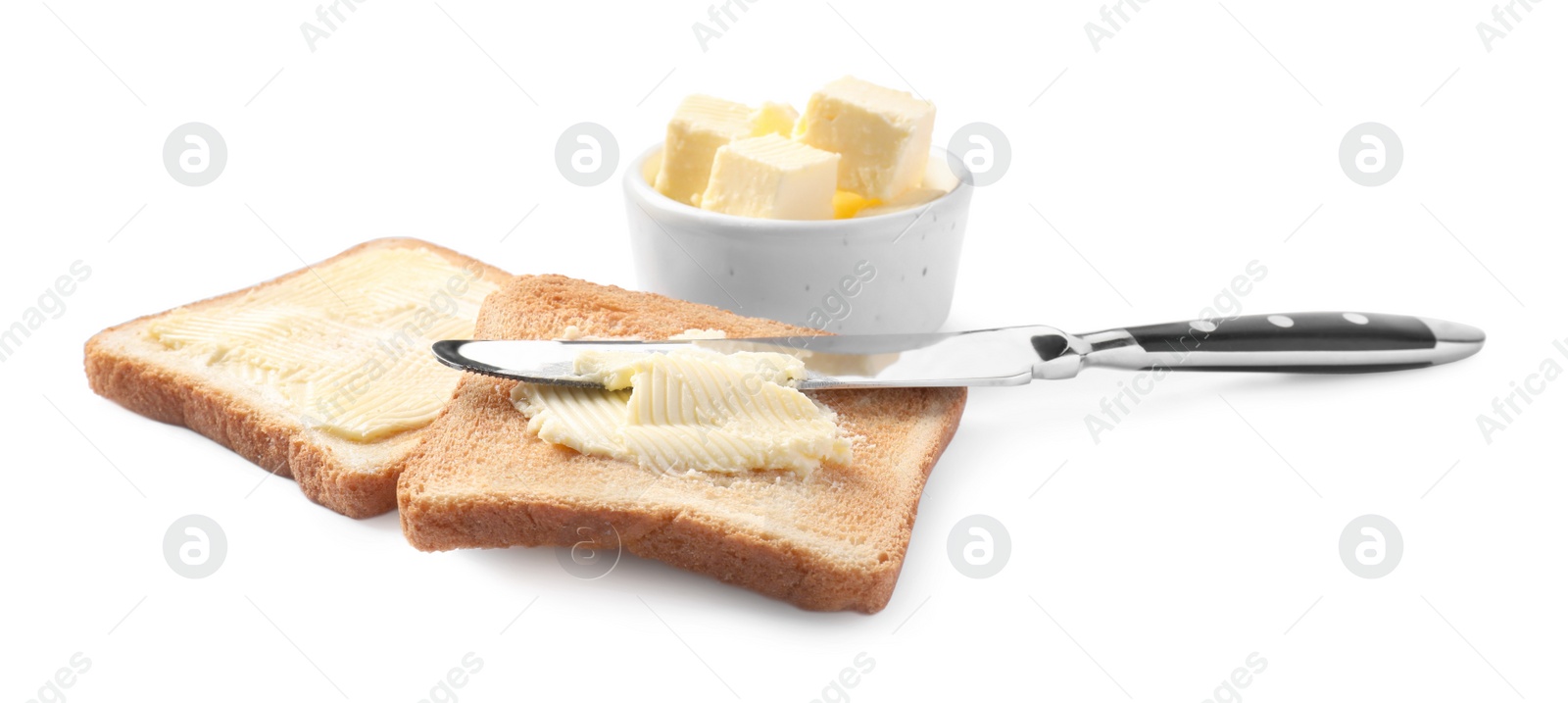 Photo of Tasty toasts with butter and knife on white background