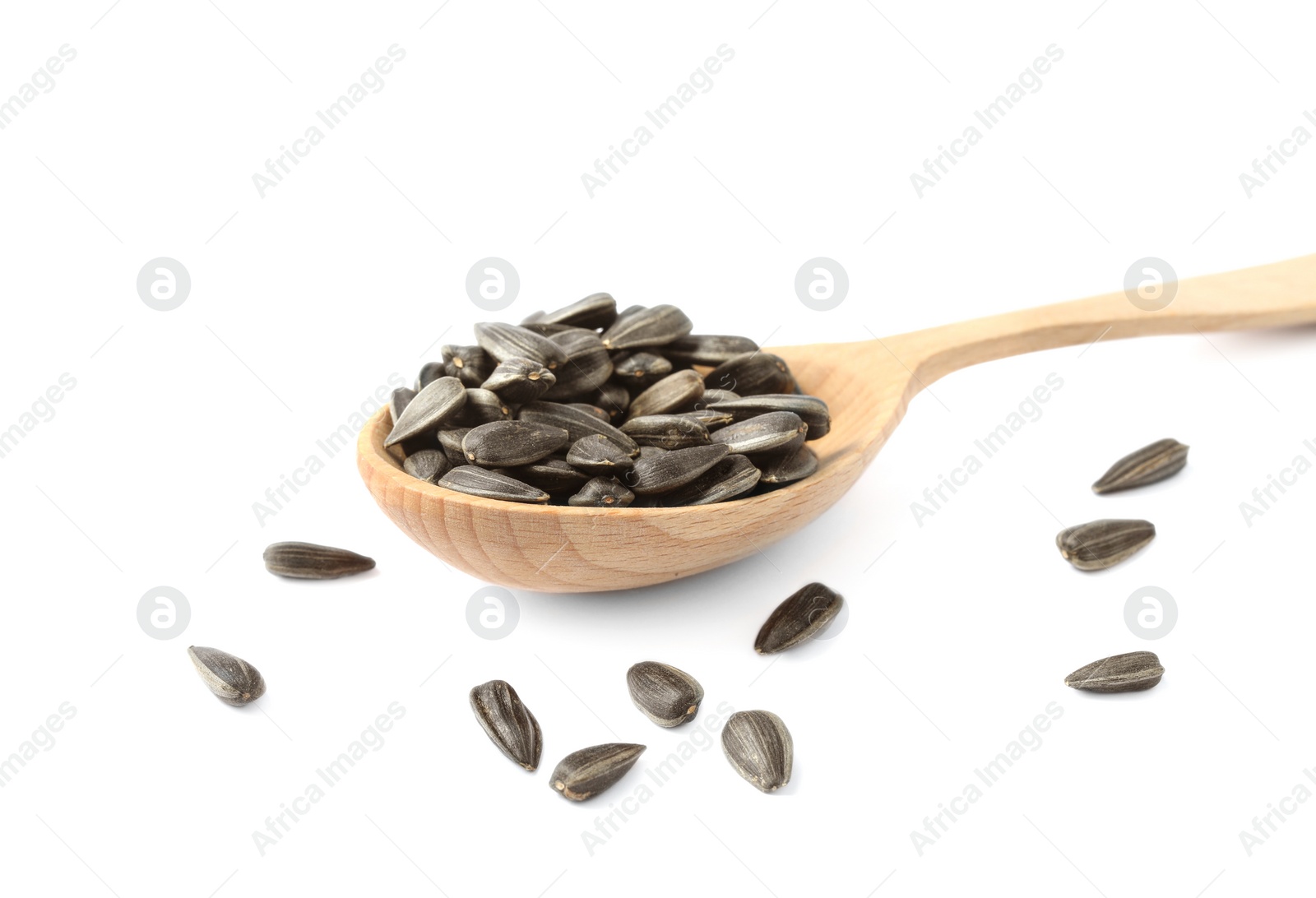 Photo of Raw organic sunflower seeds in wooden spoon isolated on white