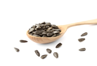 Photo of Raw organic sunflower seeds in wooden spoon isolated on white