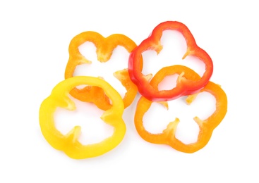 Photo of Rings of ripe bell peppers on white background, top view