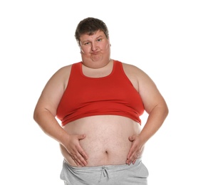 Emotional overweight man posing on white background