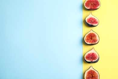 Photo of Delicious ripe figs on color background, flat lay. Space for text