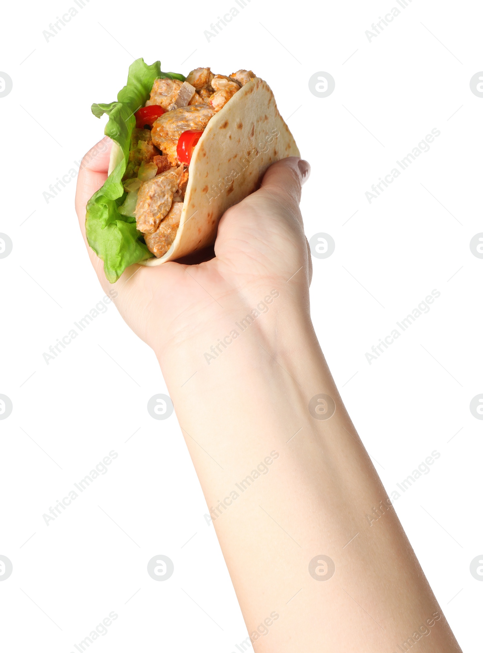 Photo of Woman holding delicious taco with meat and vegetables on white background, closeup