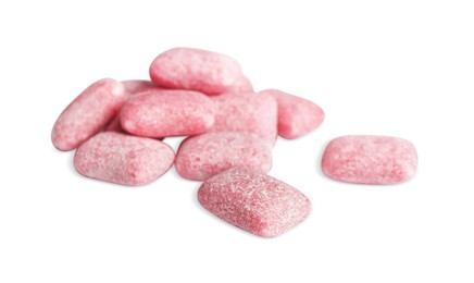 Photo of Heap of tasty sweet chewing gums on white background