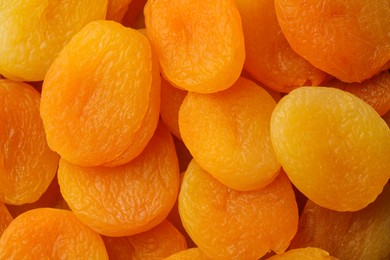 Photo of Tasty apricots as background, top view. Dried fruits