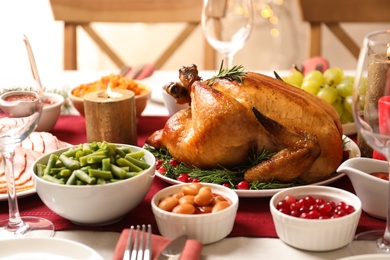 Traditional festive dinner with delicious roasted turkey served on table